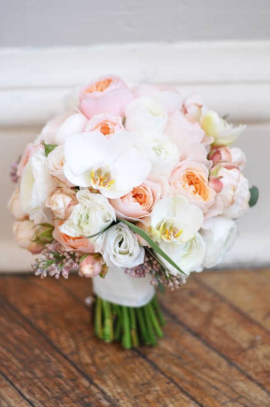 Image shows a pastel pink spring bridal bouquet at Danesfield House and Spa with orchids and roses 