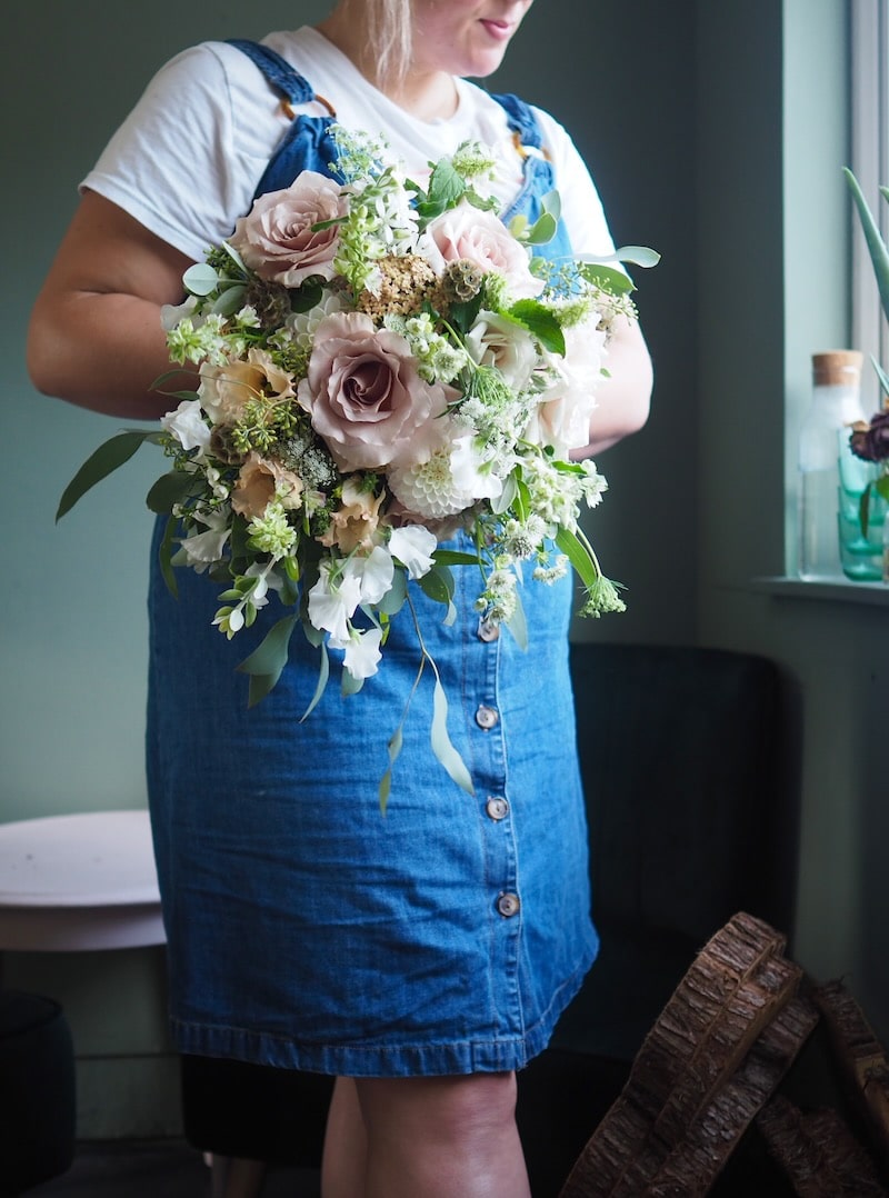 Bridal bouquet blush and pink roses and eucalyptus for a barn wedding