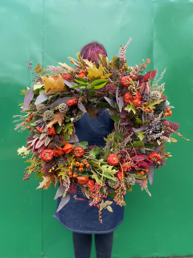 Bold autumn wreath design with vibrant flowers and rich seasonal colours