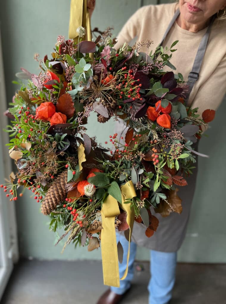 Classic autumn wreath design using rich foliage and traditional fall colours
