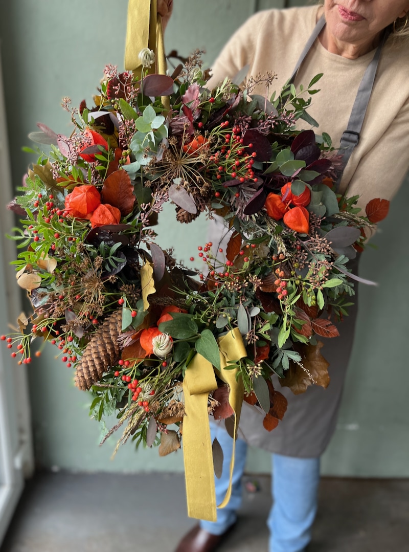 Classic autumn wreath design using rich foliage and traditional fall colours