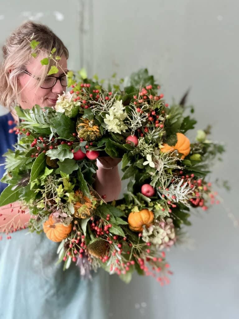 Natural autumn wreath made with woodland foliage, seed heads, and textured branches