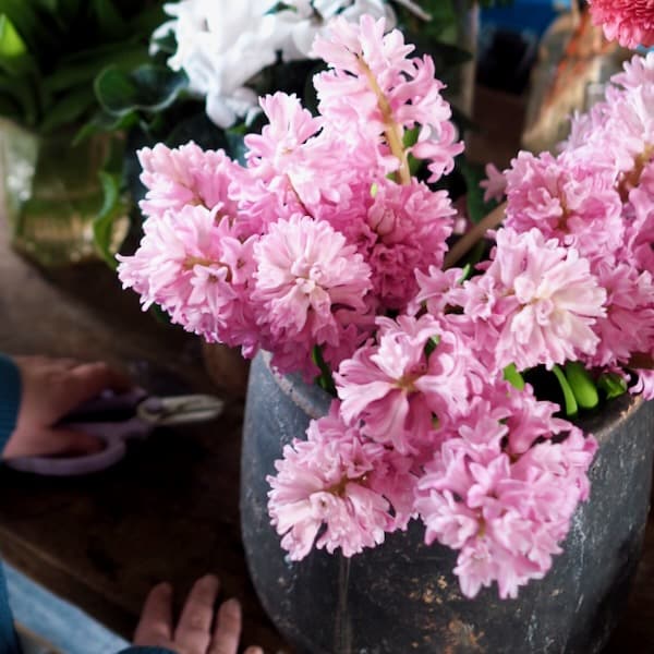 Small group floristry workshop in Berkshire with participants creating arrangements together